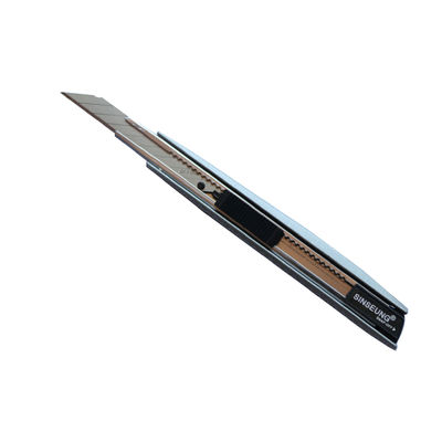 Cutter 9mm rétractable pour tapisserie, noir