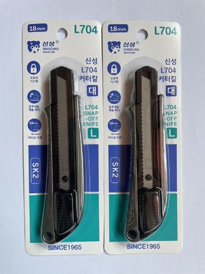 Couteau rétractable à lames de 18 mm avec verrouillage et protection de la lame